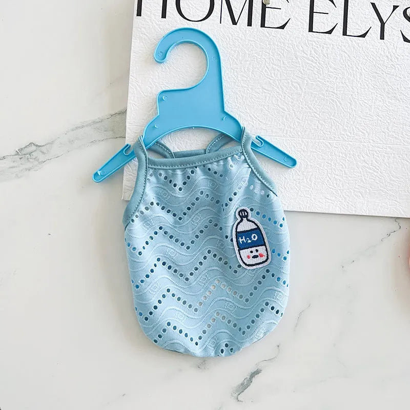 Light blue pet cooling vest with mesh straps on a mannequin, showing camisole-style cut.