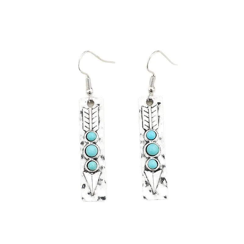 Silver geometric long strip earrings with inlaid turquoise details on a white background.