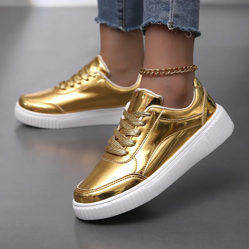 Gold sequinned platform sneakers with a round toe and a thick MD sole.