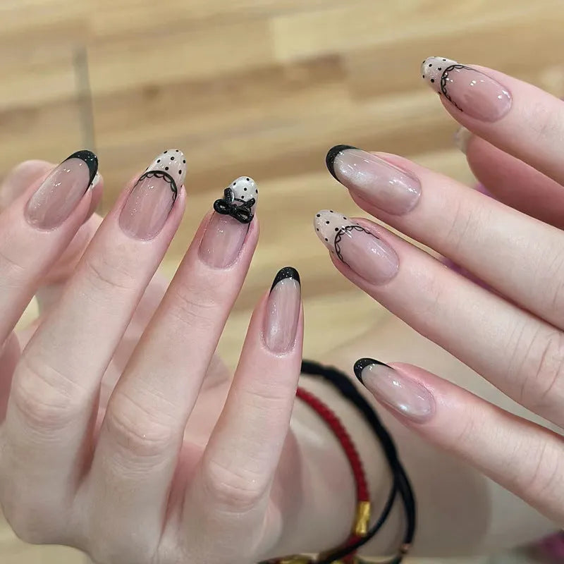 Set of colourful artificial false nails with glitter designs for DIY manicures.