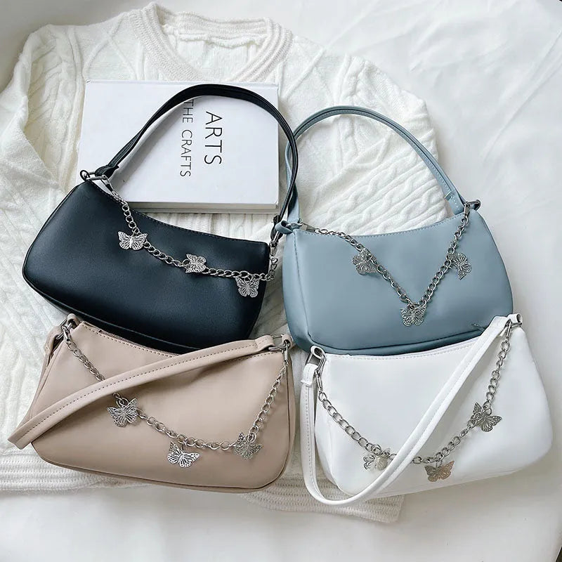 A structured square women's chain underarm bag in PU leather, shown in black, white, khaki, and light blue colour options.