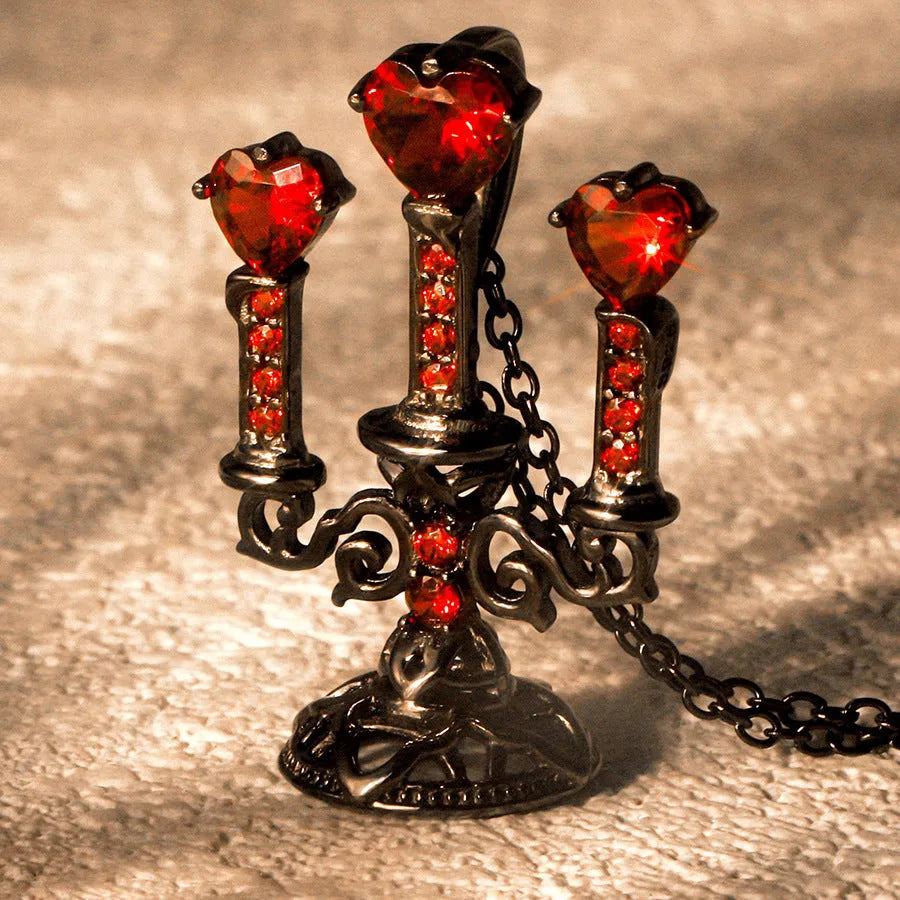 Close-up of a Gothic zinc alloy clavicle chain with a detailed hollow candlestick pendant on a cross chain.