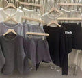 Woman's loose-fitting knitted sweater and wide-leg shorts two-piece set in oatmeal colour