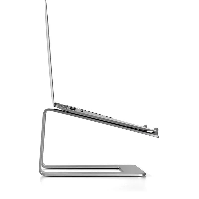 Black aluminium alloy laptop stand on a desk, showing its raised platform and dimensions.