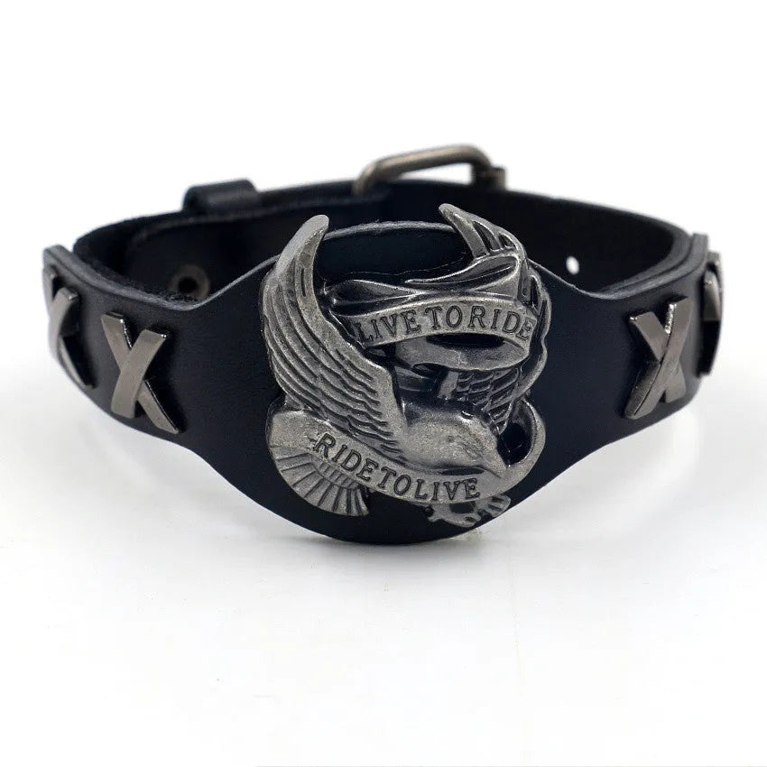 Black geometric eagle head leather bracelet with tapered width and button fastening.