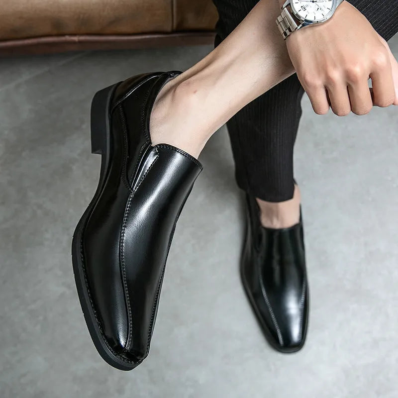 Men's black pointed toe patent leather-style shoes with totem detailing on artificial PU upper
