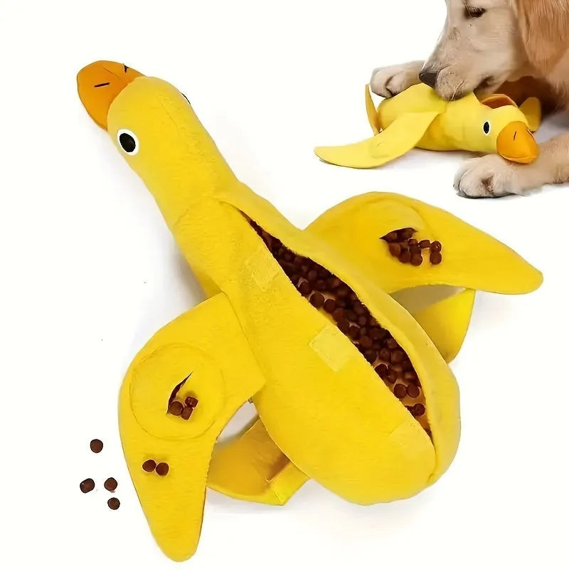 Yellow plush teddy dog toy with internal squeaky duck for training and food leak feature