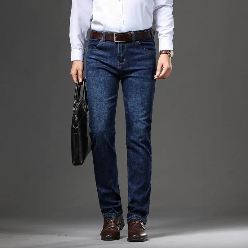 Women's loose fit, straight-leg stretch denim jeans in blue and black, showing zip fly and mid waist.