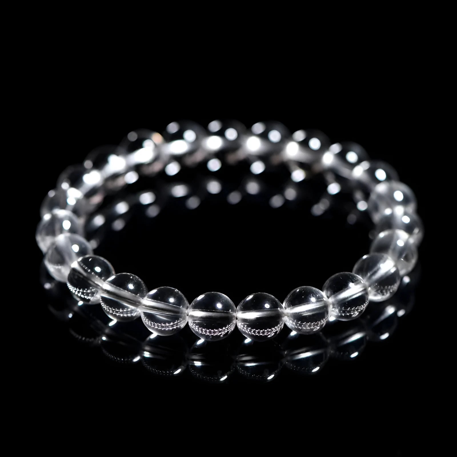 Natural Donghai old materials white water round bead crystal bracelet on a wrist, showing geometric design.