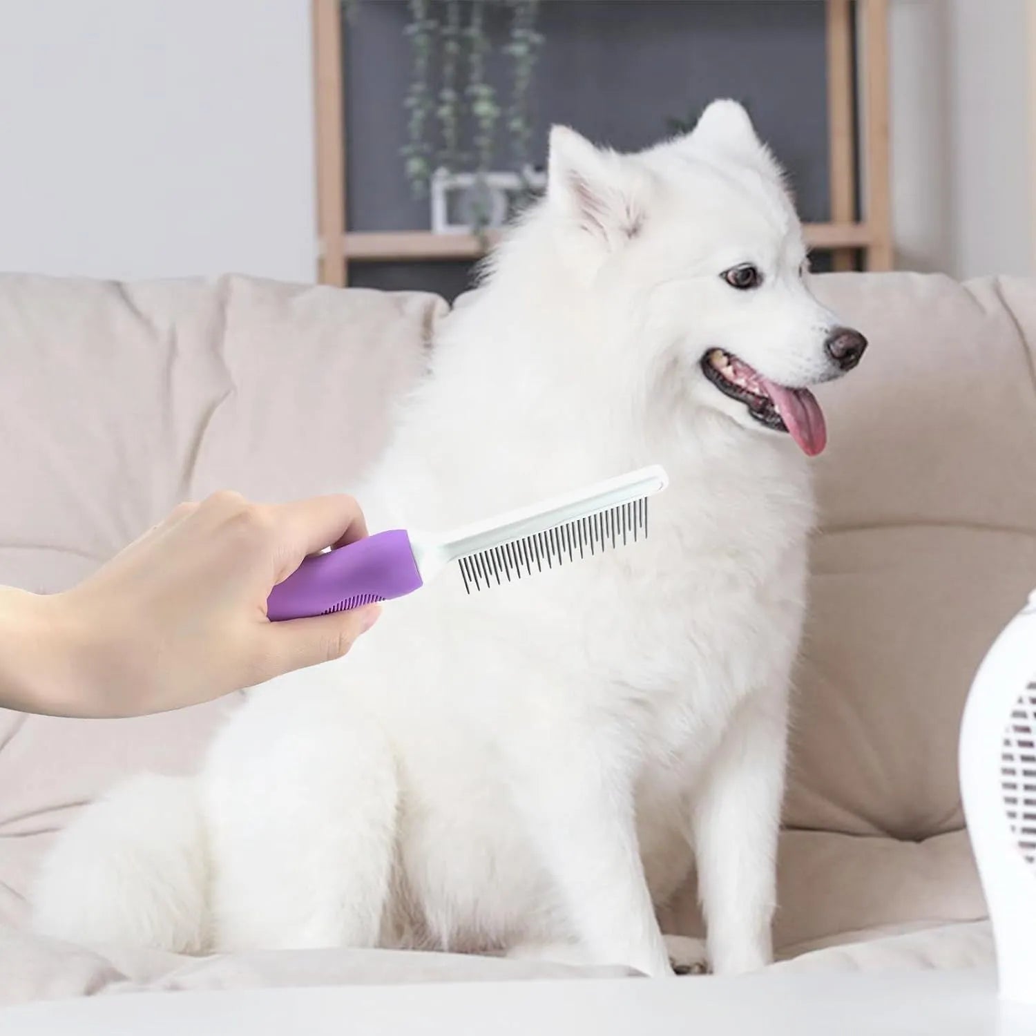 Purple pet grooming comb with stainless steel teeth on ergonomic handle