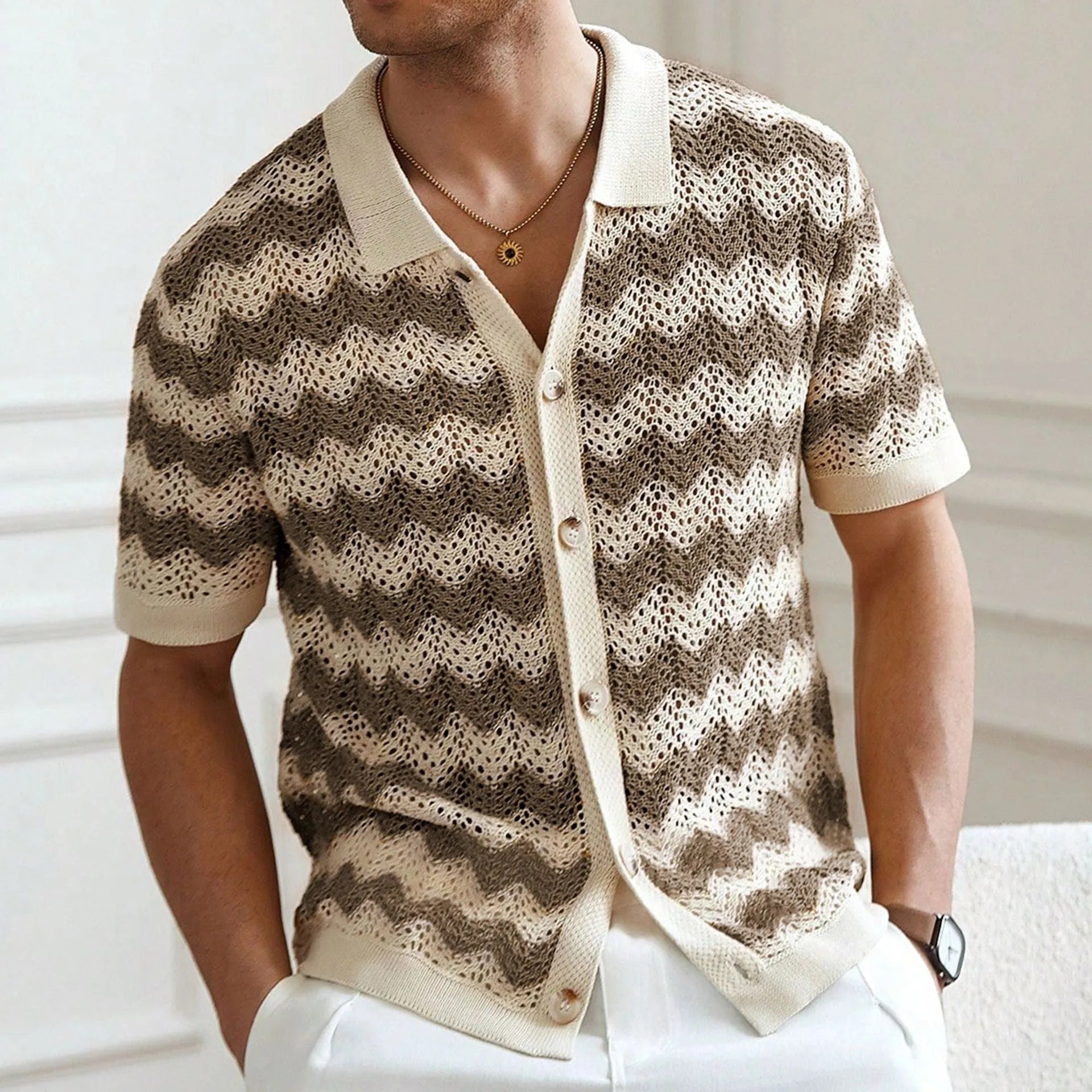 Short-sleeved yellow corrugated sweater with a hollow jacquard texture on a hanger.