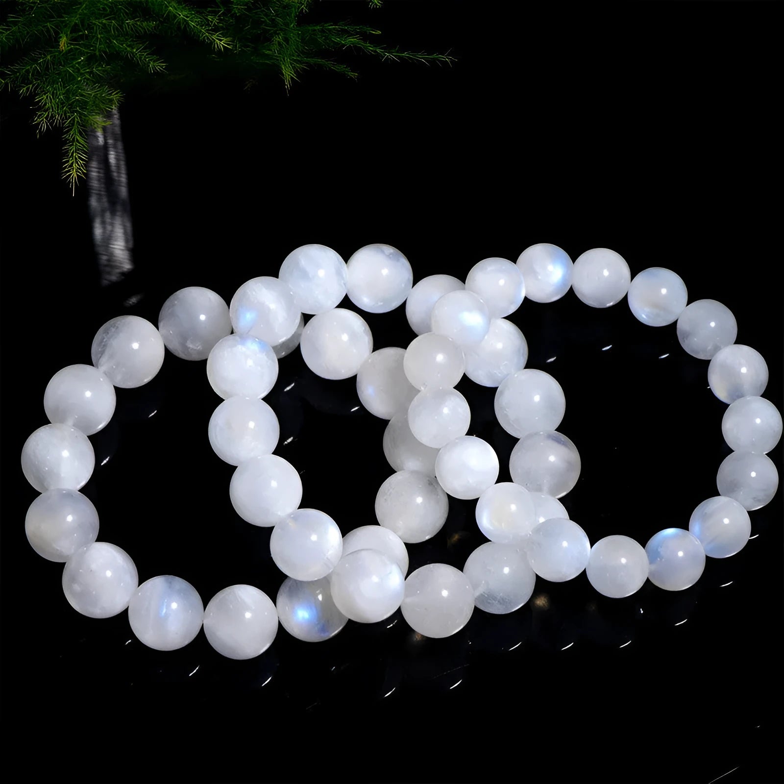 Natural moonstone round bead bracelet showing white blue moonlight colour