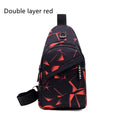 Men's blue Oxford cloth crossbody sling bag showing earphone hole and front zipper.
