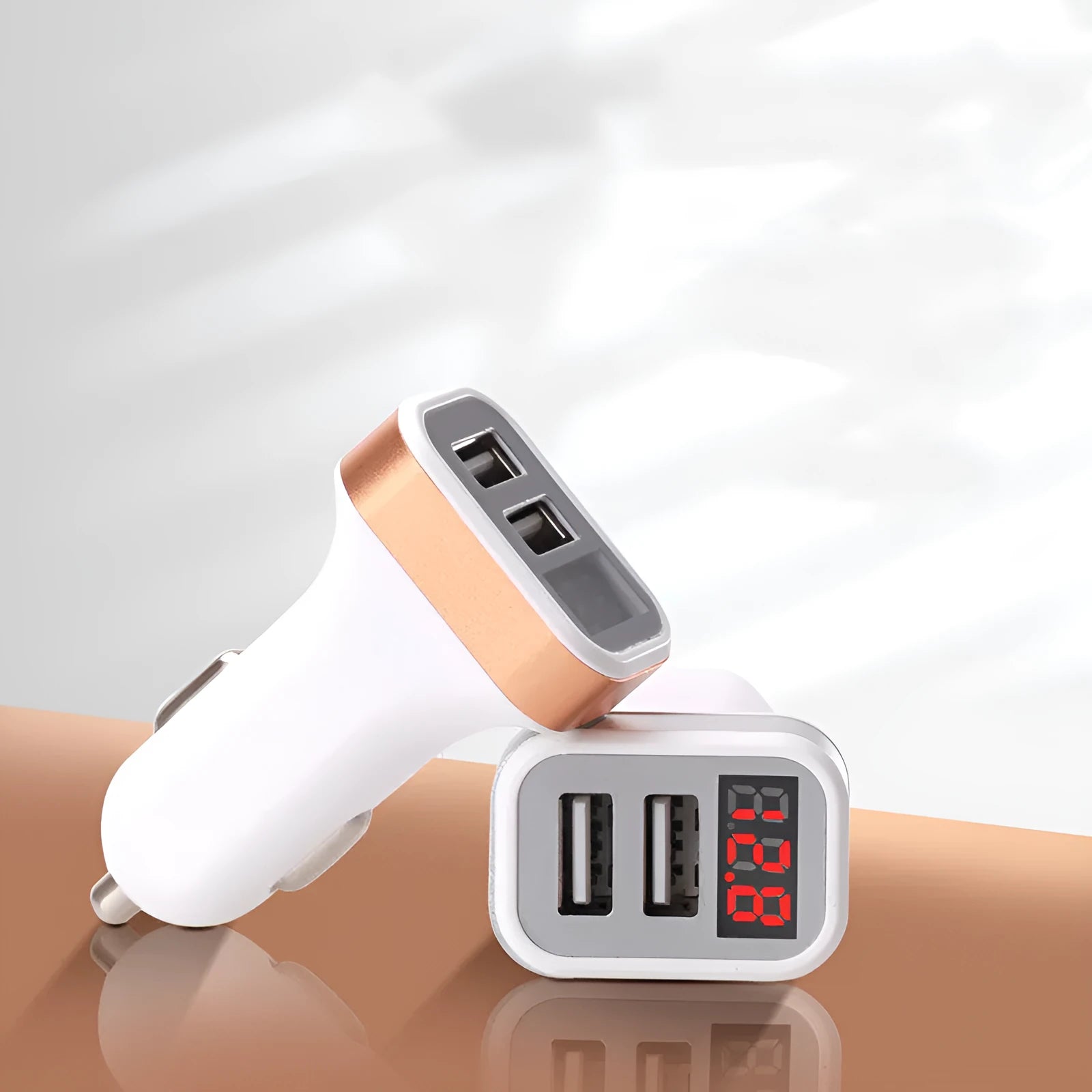 Mini digital display car charger with USB port in gold colour showing voltage readout