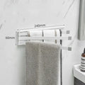 Black folding towel bar with adhesive installation for a no-drill bathroom fit.