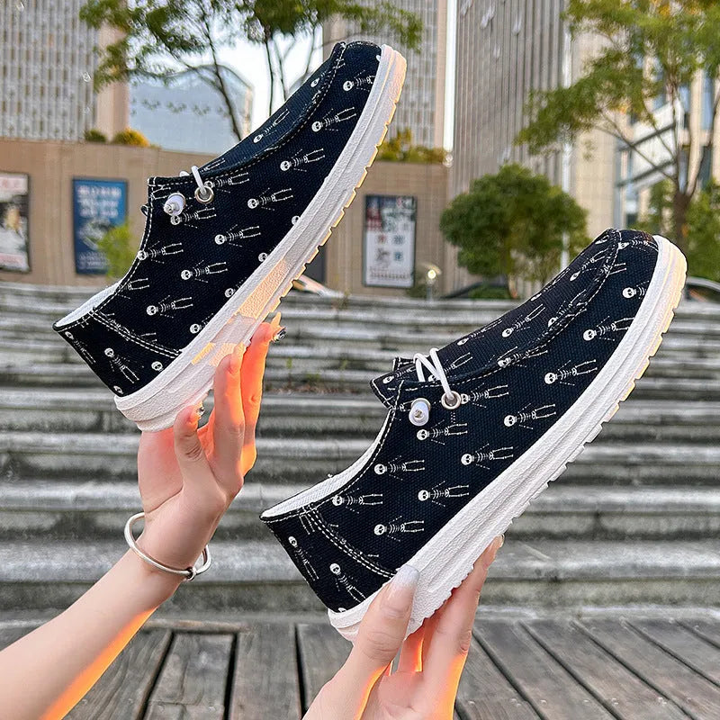 Women's black canvas low top casual shoes with soft sole, cloth lining, available in sizes 37 to 42