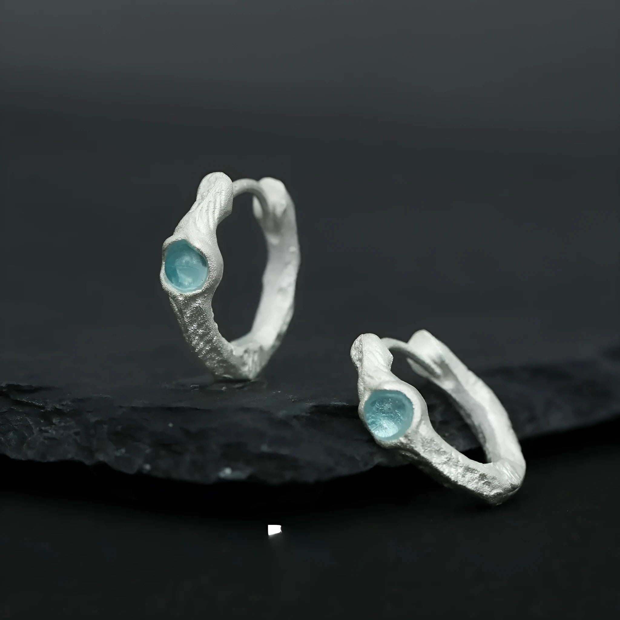 Geometric burnt silver ear clip for women with round elements made from 925 sterling silver