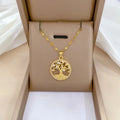 Gold-plated adjustable necklace with cross pendant showing mother of pearl inlay and rhinestone lucky tree design