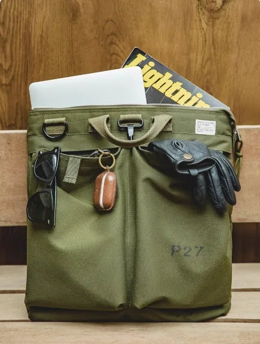 Marden Tooling charcoal black canvas messenger bag with crossbody strap, shown open to reveal laptop compartment.