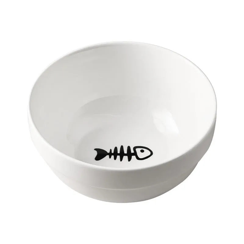White ceramic pet bowl with cat footprints design in a black iron frame.