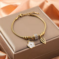 Titanium steel bracelet with electroplated colour and an inlaid shell design, showing pattern options like a five-pointed star.