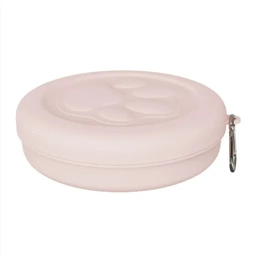 Portable plastic dog bowl for outdoor feeding and water, shown in two-tone green colour.