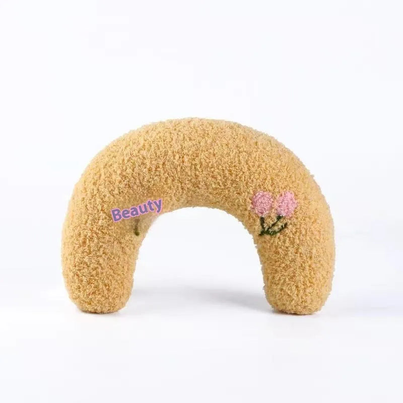 Blue U-shaped pet pillow for cat neck support with moon design on cloth material