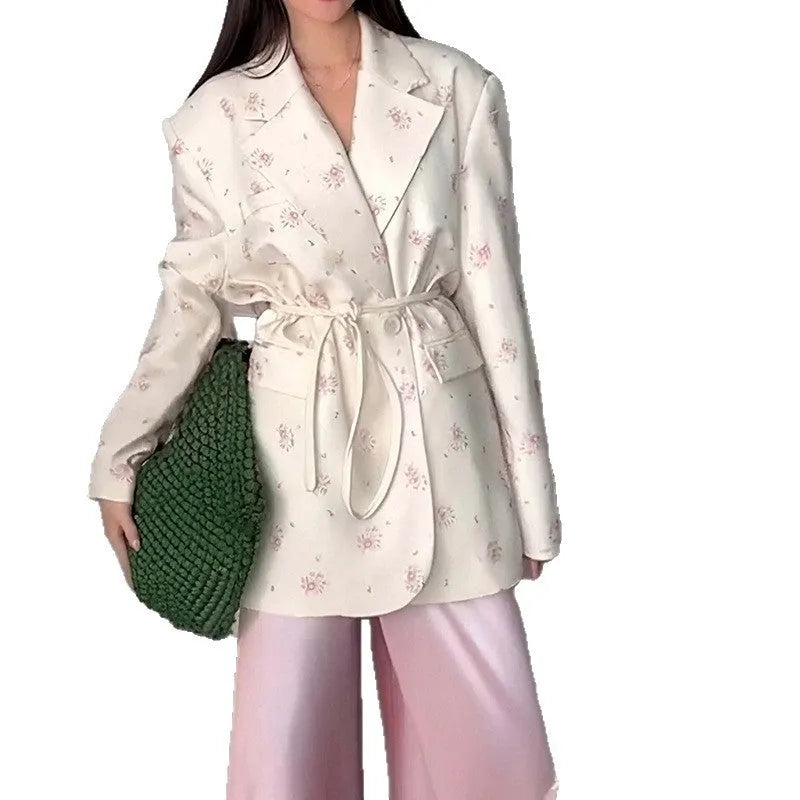 Women's white suit jacket with lace-up detail at collar and waist, long sleeves, regular fit