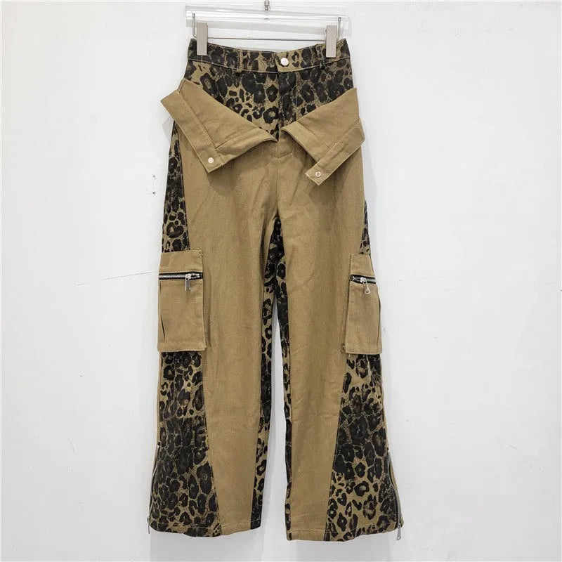 Dark khaki high-waist jeans with a leopard print pattern and tooling-style stitching details on the legs.