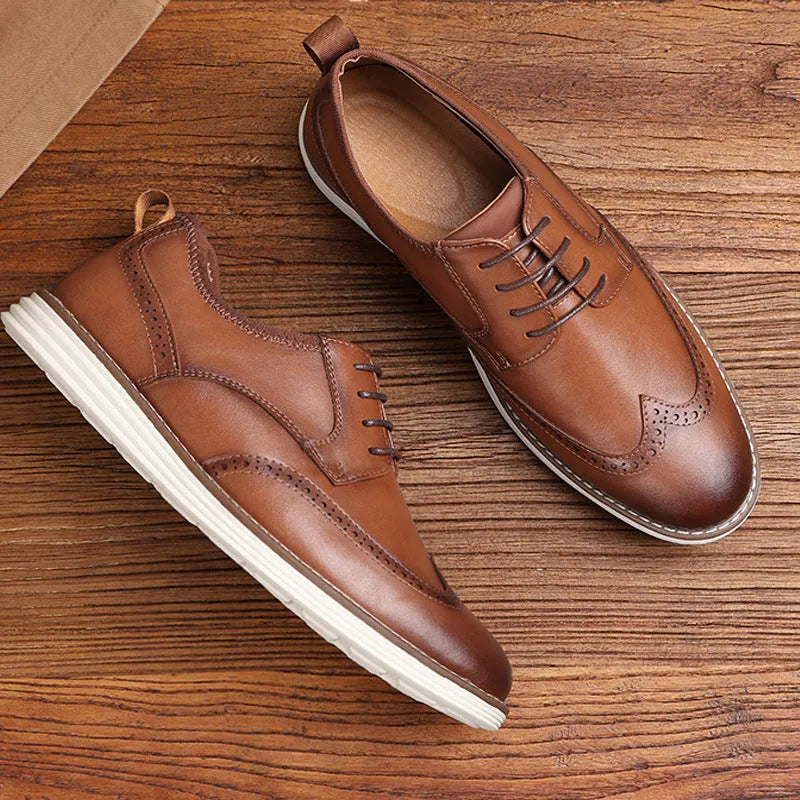 Men's black slip-on business casual shoes with decorative carving details on PU leather upper