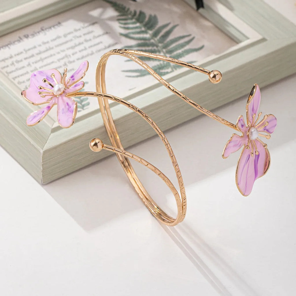 Adjustable alloy armband with hollow pattern design in pink or purple colour