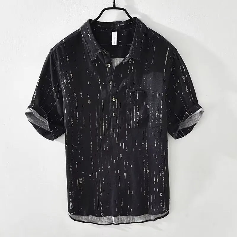 Men's loose fit black and white short sleeve polo shirt on a hanger