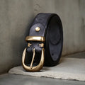 Men's black cattlehide leather casual belt with a copper pin buckle on a white background.