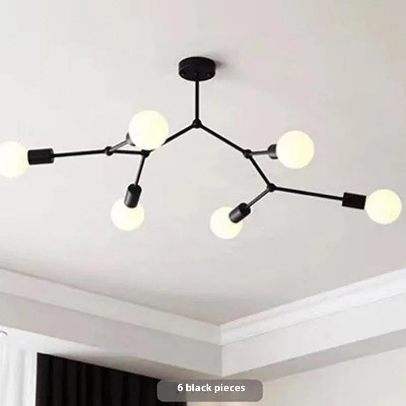 Nordic style iron ceiling chandelier with multiple black heads against a white background.