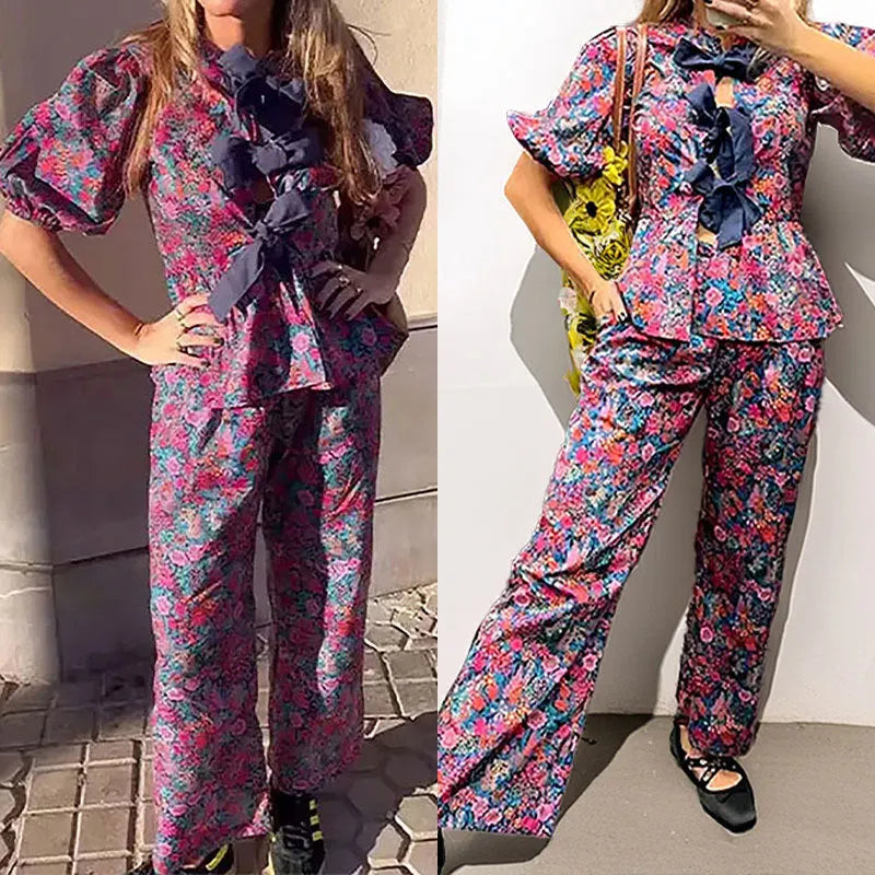 Women's floral print trouser suit set with tie-neck blouse and puff sleeves