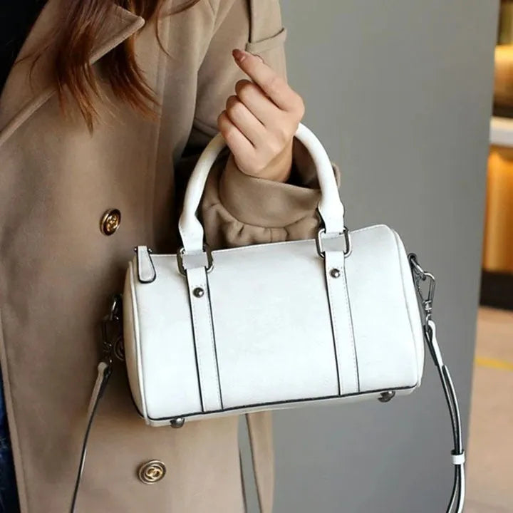 Cortex Lady casual zip crossbody bag in top grain leather, cylindrical shape, patchwork, available in caramel colour