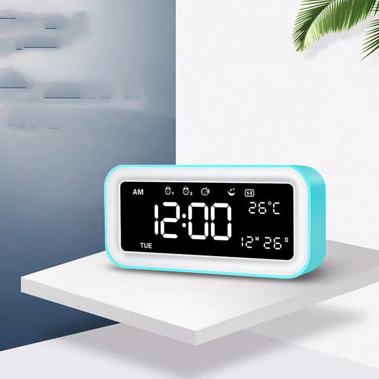 Rectangular digital alarm clock with LED atmospheric lighting and music function in blue colour option