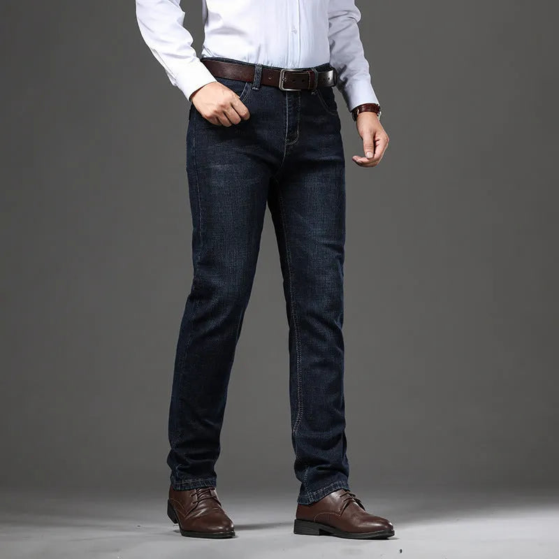Women's loose fit, straight-leg stretch denim jeans in blue and black, showing zip fly and mid waist.