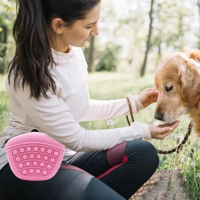Blue silicone dog training treat pouch with magnetic closure and waist clip on a belt