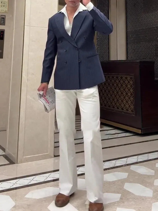 Men's striped double-breasted polyester blazer showing regular fit and traditional styling