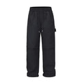 Black baggy men's paratrooper pants with a drawstring waist and three-dimensional cutting.