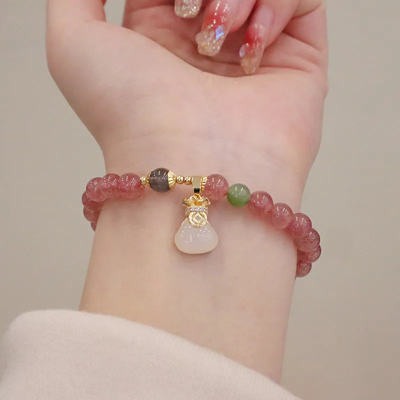 Pink strawberry quartz purse bracelet with geometric shapes and safety buckle closure