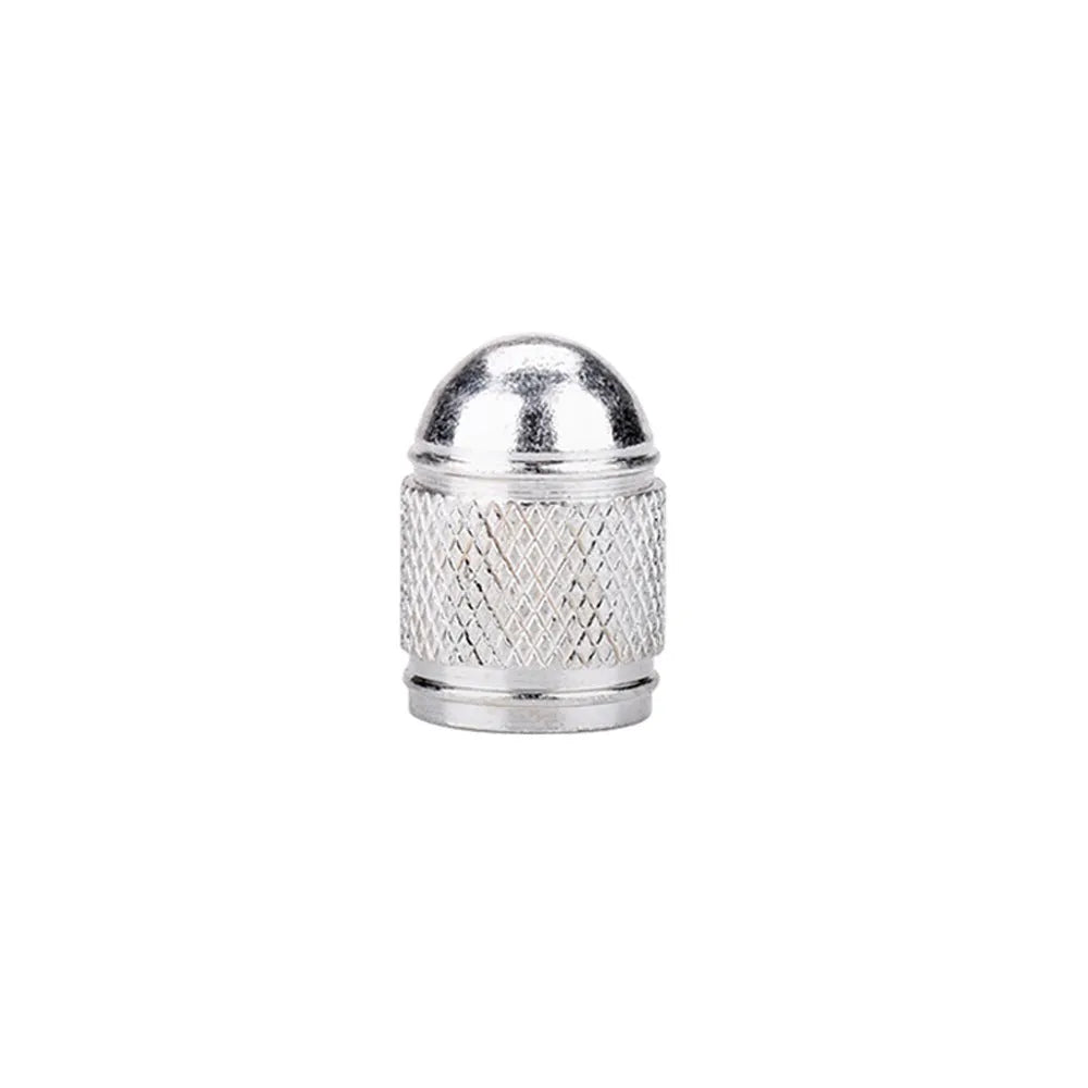Aluminium mountain bike tyre valve dust cap in gold, red, silver, blue, and black colours.
