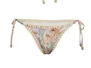 Women's floral bikini swimsuit set with skirt in creamy-white colour, showing top, briefs, and cover-up components