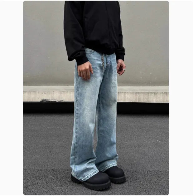 Men's blue straight leg jeans with whisker washing and flared leg style on medium-high waist