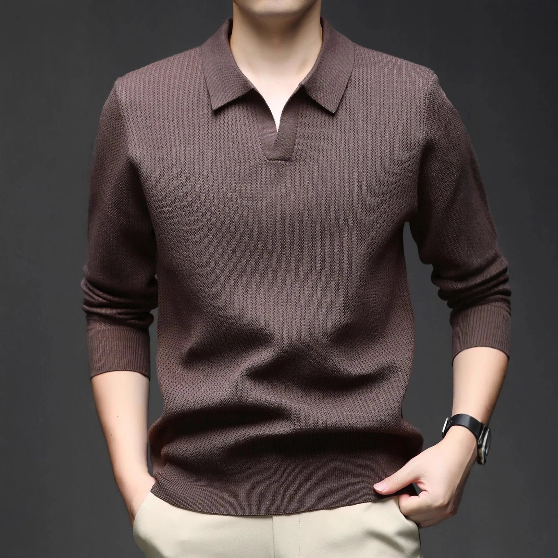 Men's loose green pullover sweater on a hanger, casual autumn wear