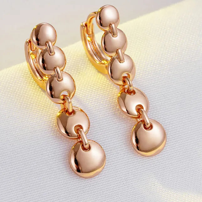Gold-coloured copper retro earrings with woven texture in long round circle shape