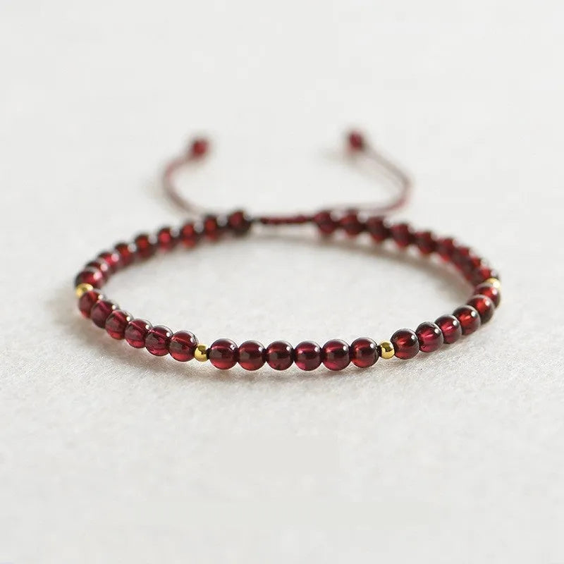 Women's freshwater pearl and geometric crystal bracelet on a stretchy elastic rope.