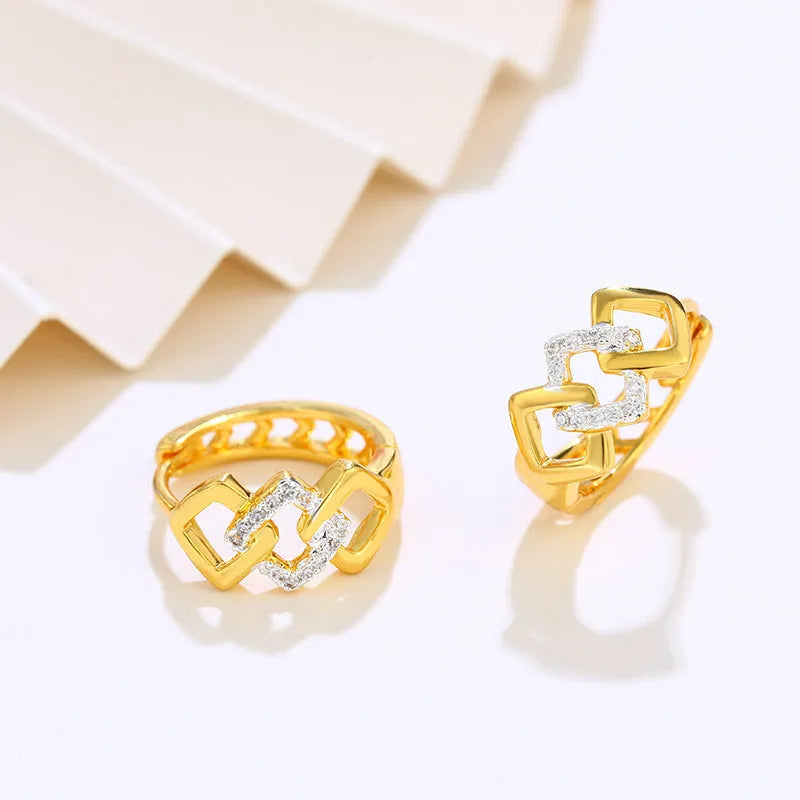 Gold geometric hollow-out earrings with colour separation detail on ear clips