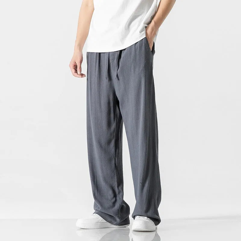 Men's cropped linen trousers in bamboo fibre with a loose straight-leg fit and drawstring waist.